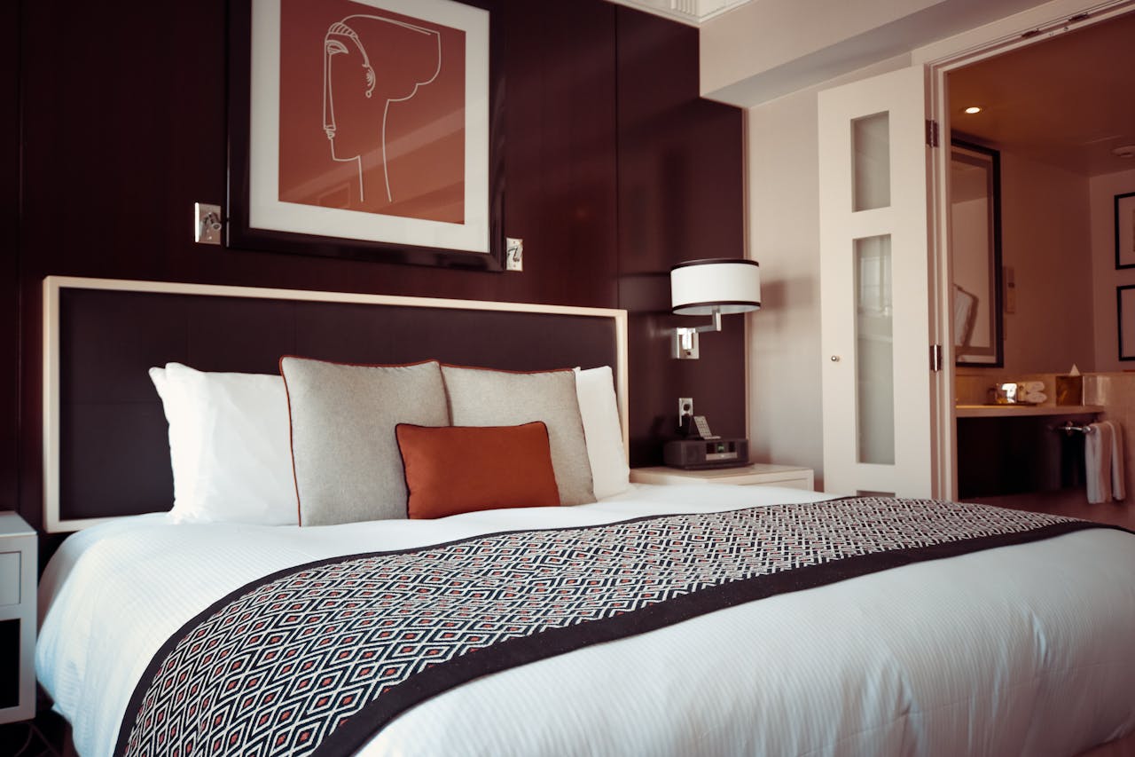 services-05 Cozy and modern hotel bedroom interior with elegant decor and soft lighting.
