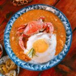 pexels photo 20167871 Delicious crab curry served with rice and a fried egg, shot in Jeju, South Korea.