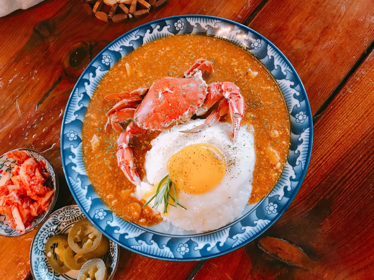 Delicious crab curry served with rice and a fried egg, shot in Jeju, South Korea.